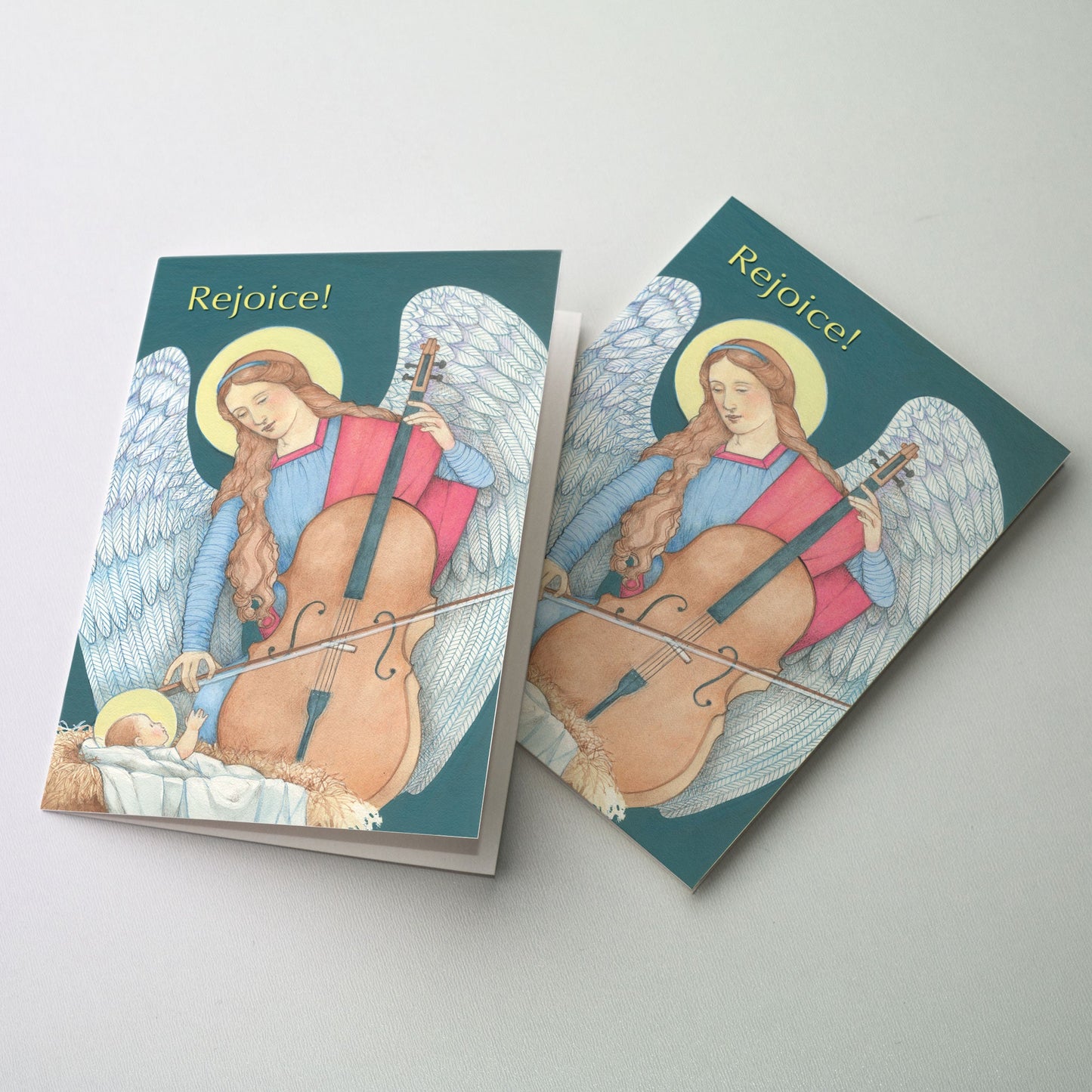 Angel playing a cello worshiping the Christ Child through her music