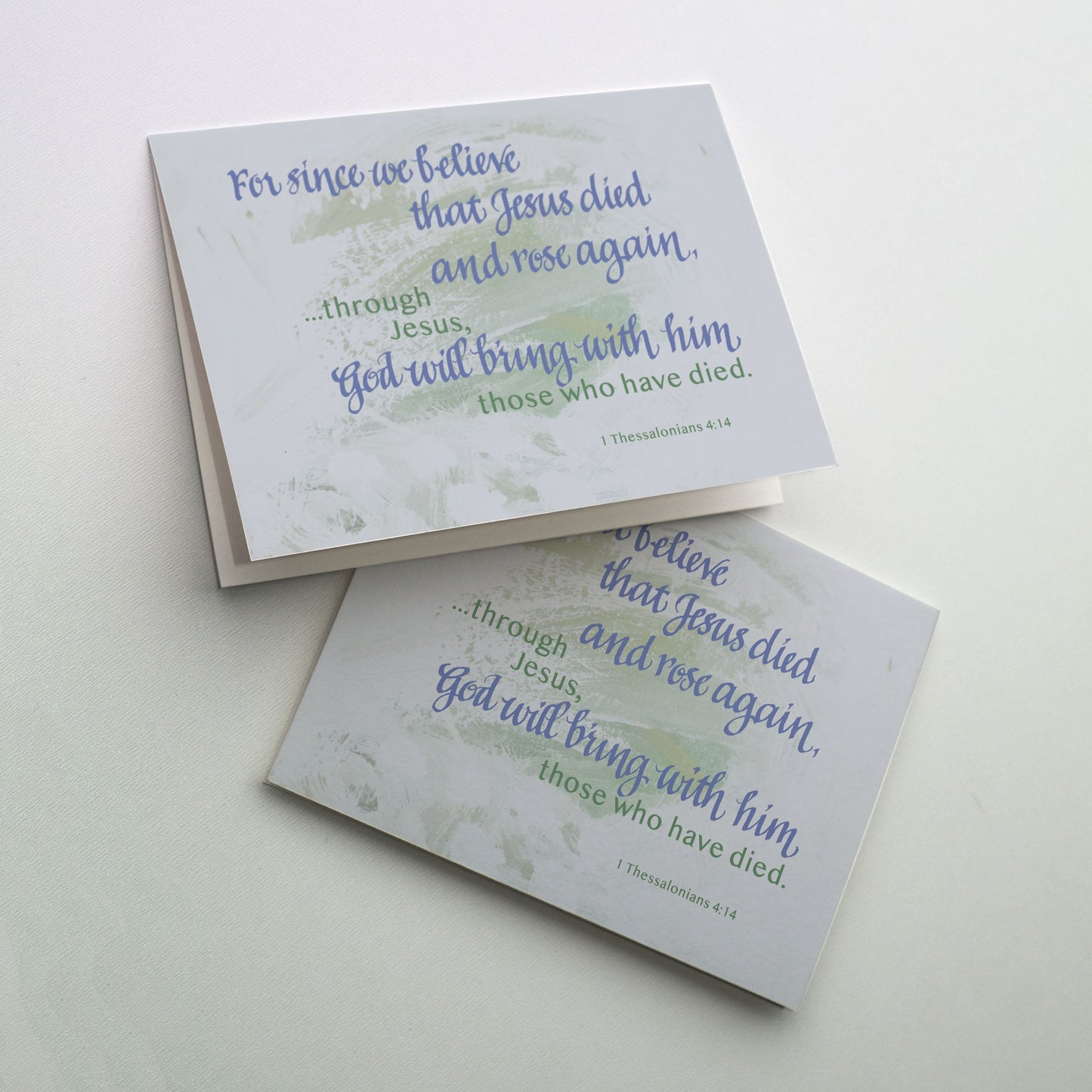 Softly painted expressive background sets off cover calligraphy accented with silver metallic ink.