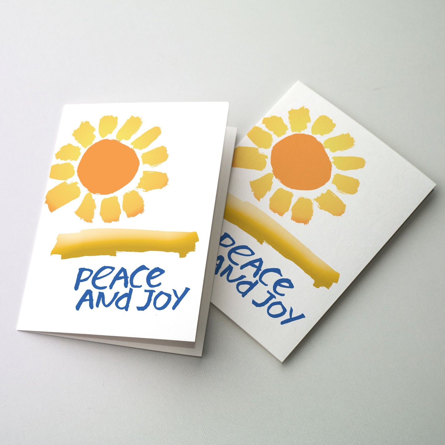 Coloful shining sun with message of Peace and Joy in calligraphy by David Mekelberg