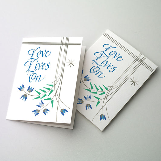 Delicate silver linework flowers with blue calligraphy