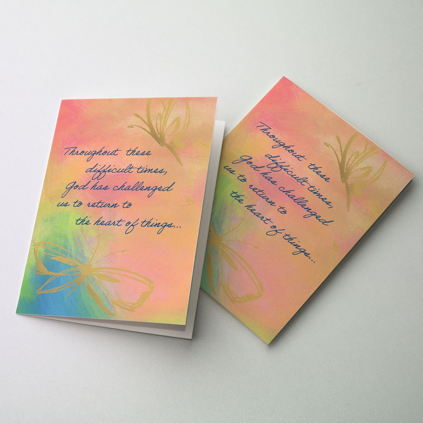 Soft gold images of butterflies on pastel colored background