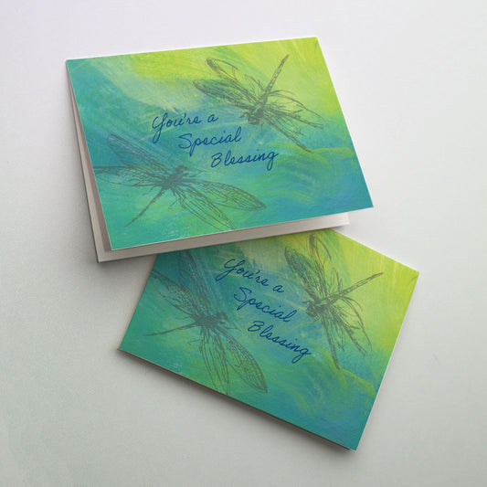 Soft silver images of dragonflies on a pastel background