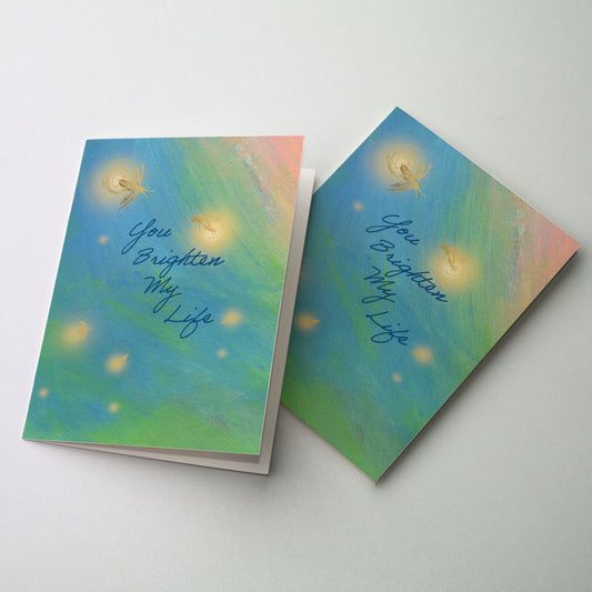 Soft gold images of fireflies on a pastel background.