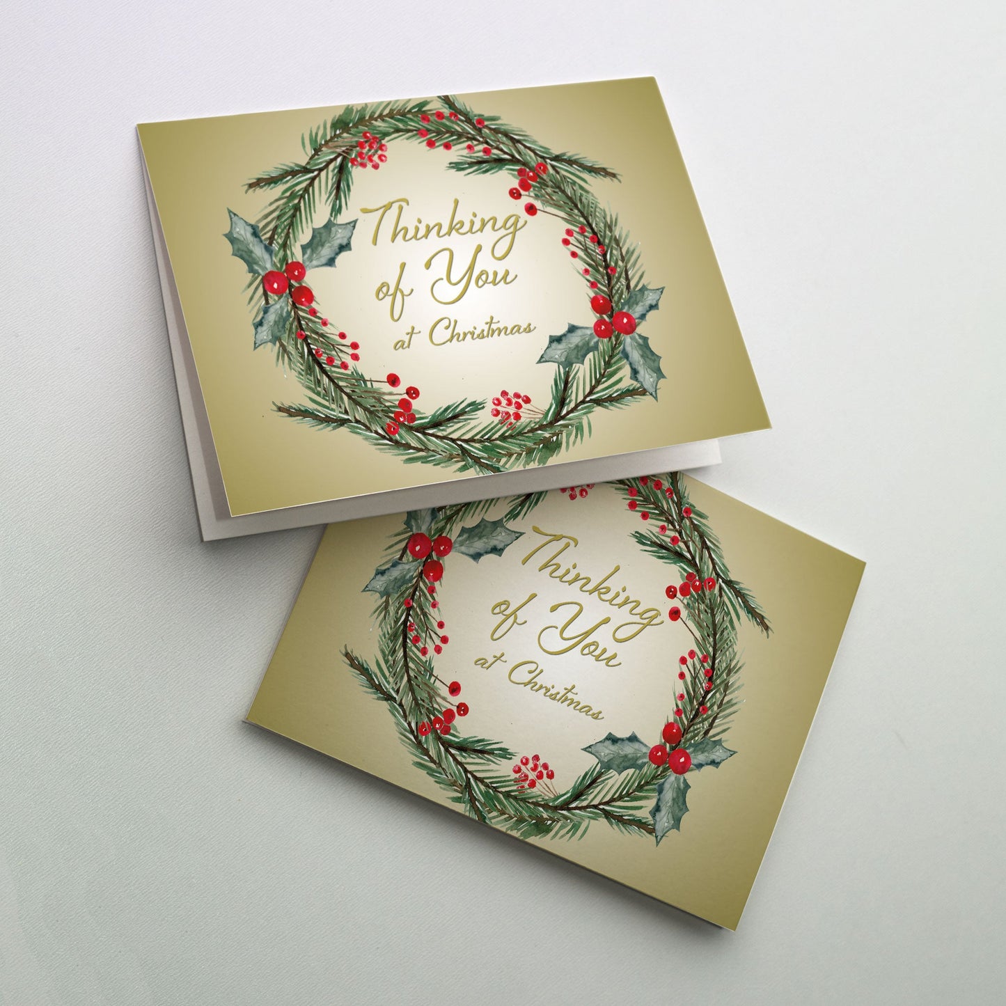 Christmas wreath surrounding cover text on a golden background