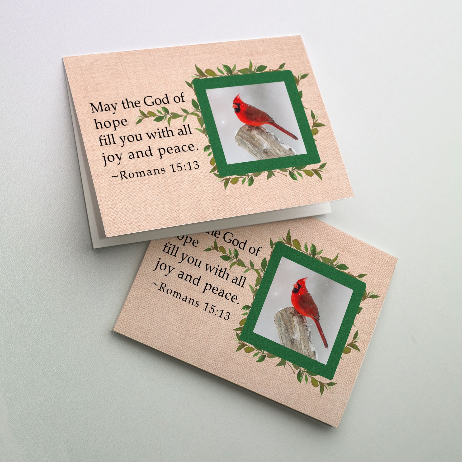 Prominent cover bible verse alongside photo snapshot of red cardinal in a green leafy border.