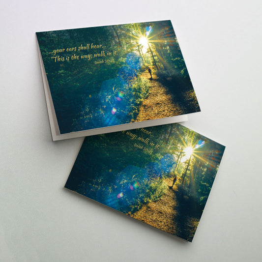 Send this biblically inspired Graduation card to your beloved graduate. The cover photograph shows a person walking on a trail with a bright sun lighting the way. 