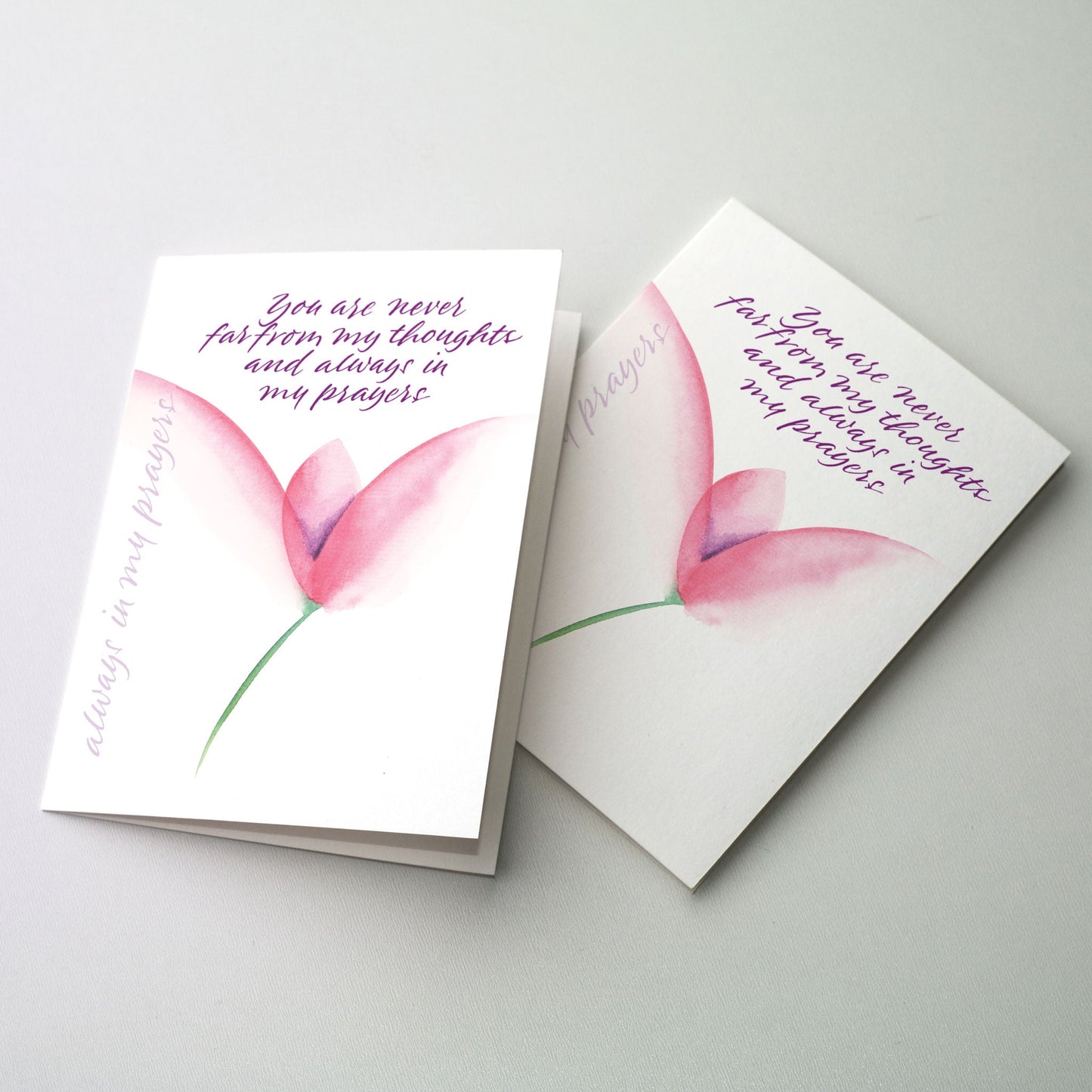 Express your thoughts of concern and prayer in calligraphy accented by a dark pink flower. The cards measure 5&quot; x 7&quot;. Printed on recycled paper.