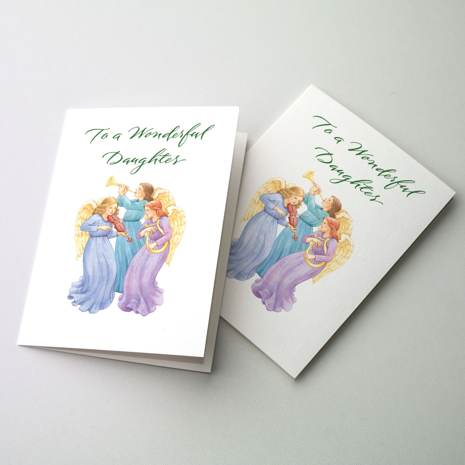 <p>Angels playing musical instruments.</p><ul><li>Generous 5 x 7 inch size</li><li>Hand-done lettering</li><li>Single fold card style</li><li>Appropriate Bible verse included inside</li><li>Fine quality envelopes</li></ul>