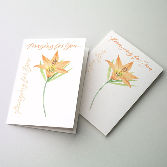 Orange Day Lily on white ground with lettering along the fold edge and top of the card.