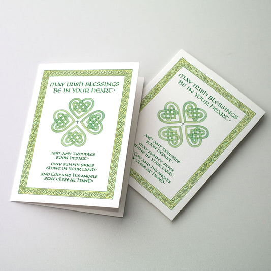 <p>Text appears in olive colored Uncial lettering with the central image of four hearts in Celtic knotwork forming a shamrock. A green border surrounds the image.</p>