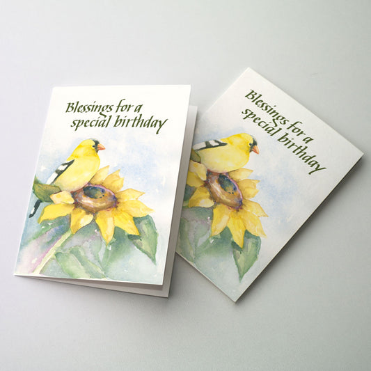 Watercolor illustration of a Goldfinch perched on a yellow sunflower with lettering in green at the top of the image.