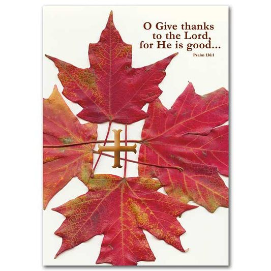 Bright autumn leaves surrounding a foil stamped cross